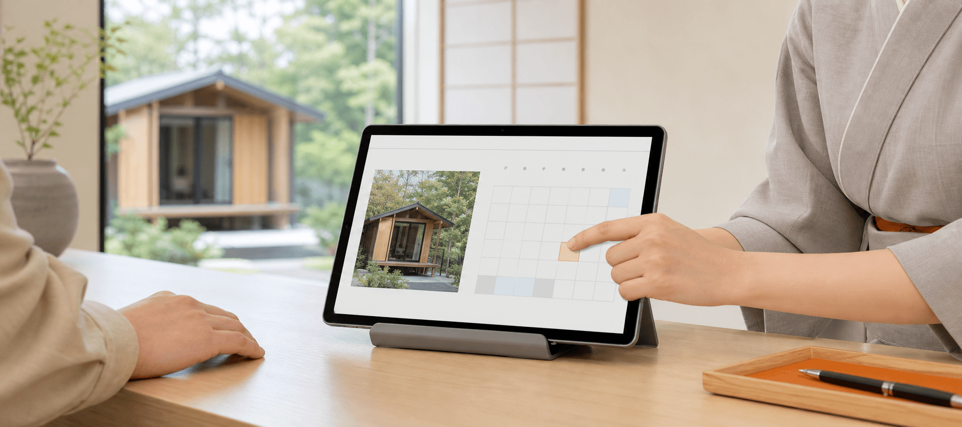 タブレットでコテージなどサブ施設の予約を受け付ける様子
