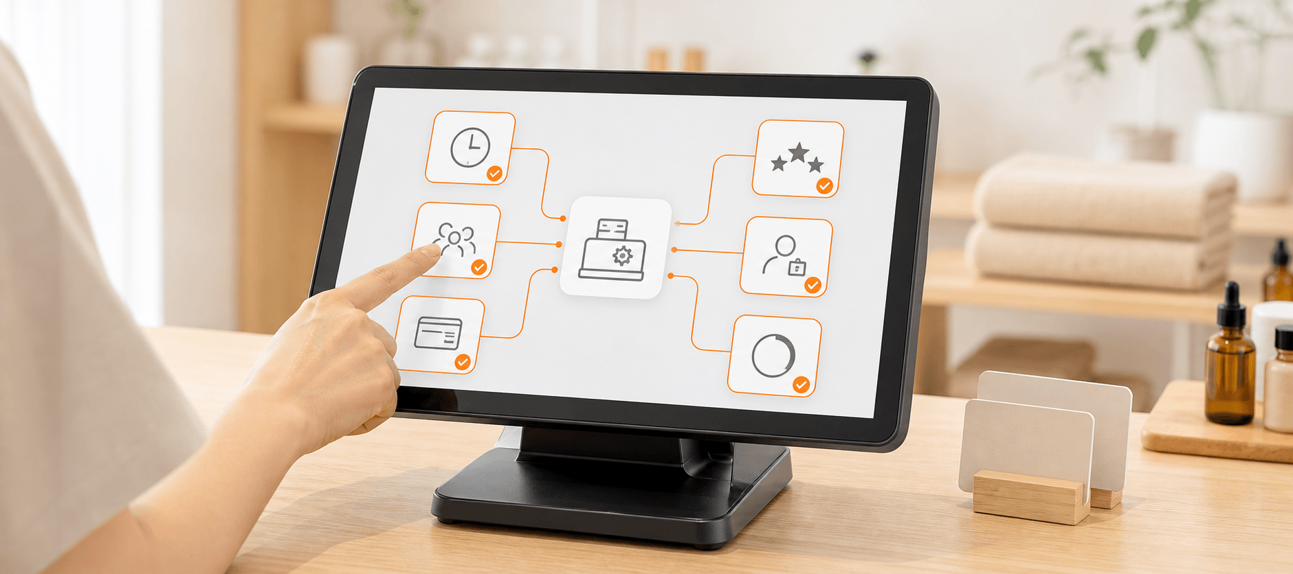 スタッフがタブレットで会員ランク別の料金設定を確認する様子